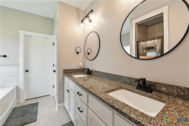 15933 Salado Dr, Temple, TX 76502 - bathroom with double vanity and a tub to relax in