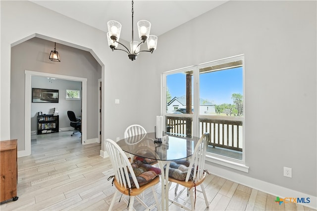 15933 Salado Dr, Temple, TX 76502 - dining space featuring healthy amount of natural light, light wood-type flooring, and arched walkways