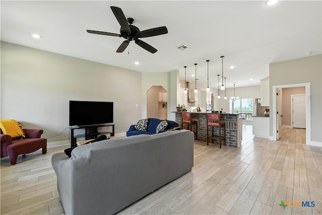 15933 Salado Dr, Temple, TX 76502 - living room with light wood-style flooring, ceiling fan, and recessed lighting