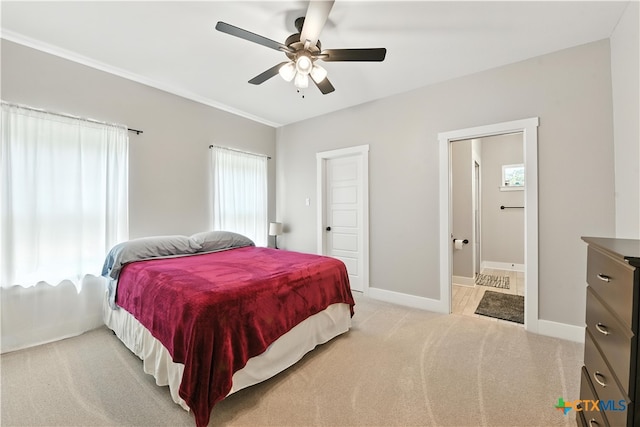 15933 Salado Dr, Temple, TX 76502 - bedroom with light colored carpet, connected bathroom, and ceiling fan