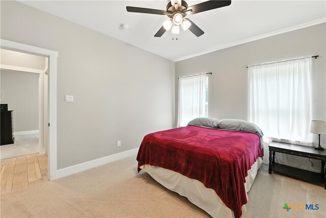 15933 Salado Dr, Temple, TX 76502 - bedroom featuring light colored carpet, ceiling fan, and ornamental molding