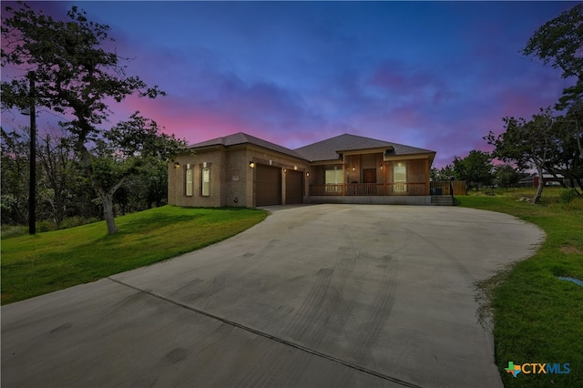 15933 Salado Dr, Temple, TX 76502 - prairie-style house with an attached garage, driveway, a front yard, and a porch