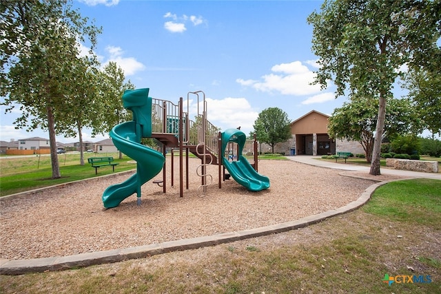 communal playground with a lawn