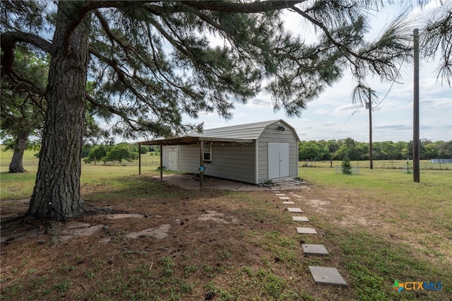 1975 Taylorsville Rd, Red Rock, TX 78662 - view of yard featuring a carport, an outbuilding, and a shed