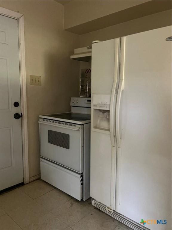 410 Railroad St, San Marcos, TX 78666 - kitchen featuring white appliances, under cabinet range hood, and light tile patterned floors