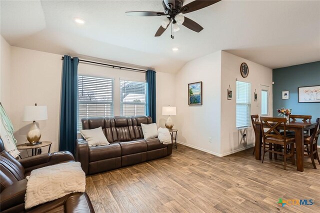 living area featuring light wood finished floors, recessed lighting, ceiling fan, and baseboards