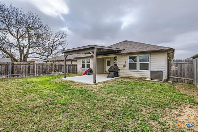 back of property featuring cooling unit, a lawn, a fenced backyard, and a patio area