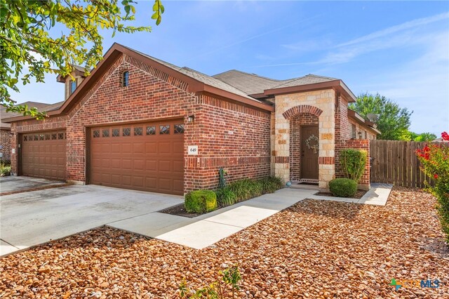 view of front of property featuring a garage