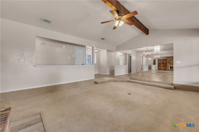 unfurnished living room featuring carpet flooring, lofted ceiling with beams, and ceiling fan with notable chandelier