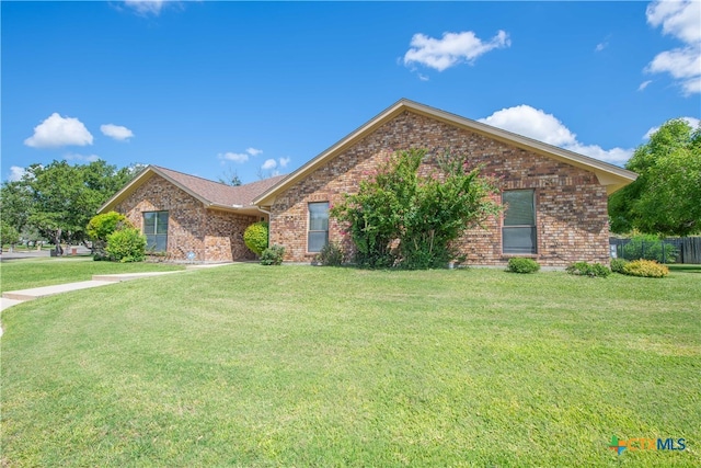 view of front of home with a front lawn