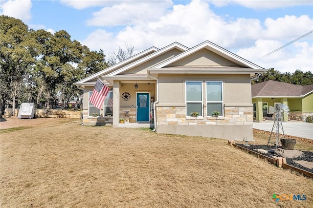 view of front of property with a porch and a front yard