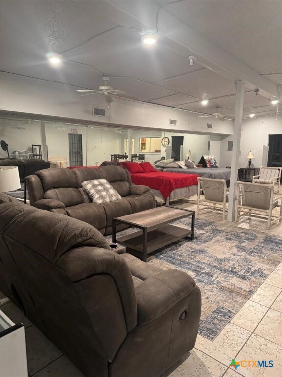 living room with a ceiling fan