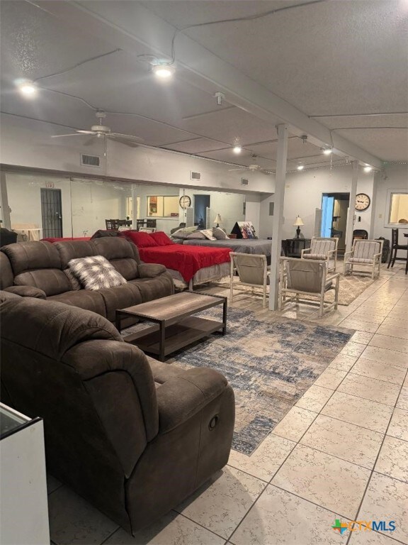 misc room with ceiling fan