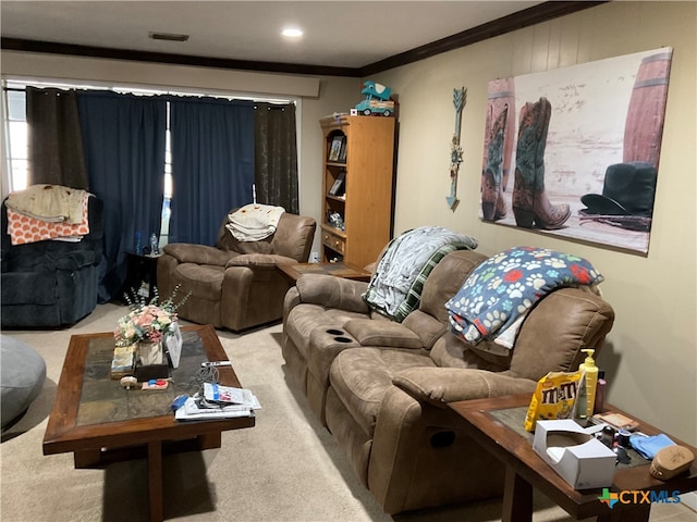 living room with ornamental molding and light carpet