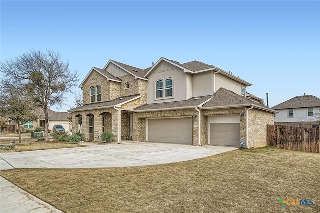 view of front of home with a garage and a front lawn