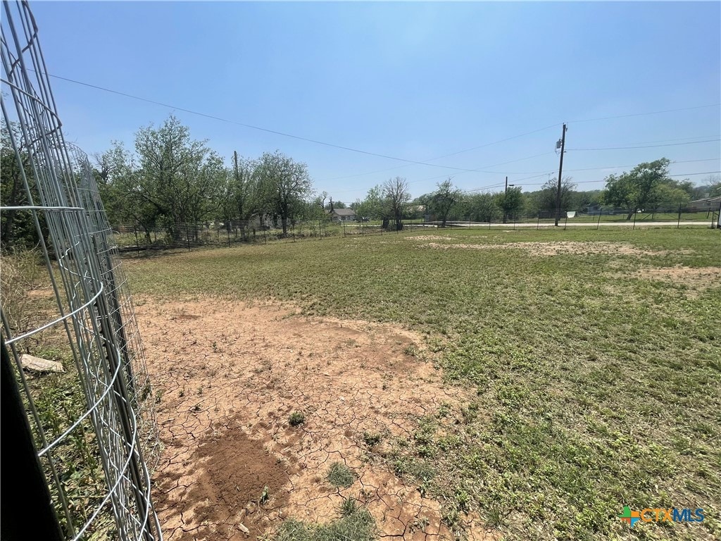 view of yard with a rural view