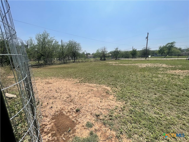 view of yard with a rural view