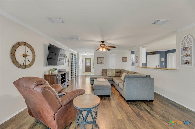 116 Bufflehead Ln, Leander, TX 78641 - living area featuring ornamental molding, wood finished floors, baseboards, and a ceiling fan