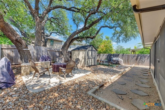 116 Bufflehead Ln, Leander, TX 78641 - fenced backyard featuring a patio area and a fire pit