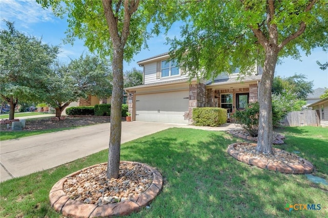 116 Bufflehead Ln, Leander, TX 78641 - view of front of house with an attached garage, driveway, and a front lawn