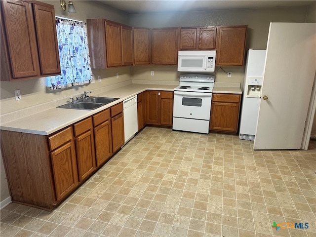 kitchen with sink and white appliances