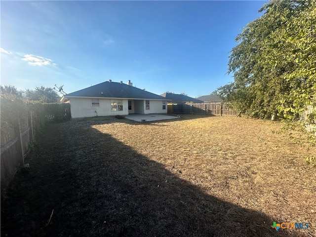 rear view of house with a patio area