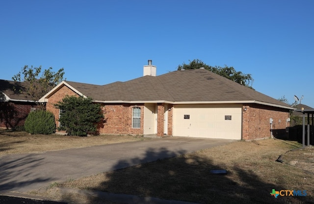 ranch-style house featuring a garage