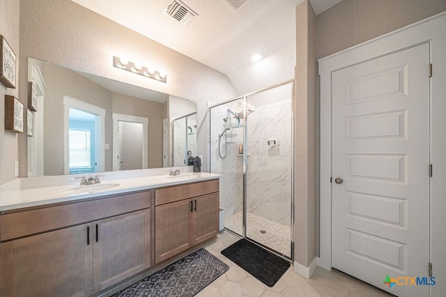 3627 Twin Dish Way, New Braunfels, TX 78130 - bathroom featuring a marble finish shower, double vanity, and tile patterned floors