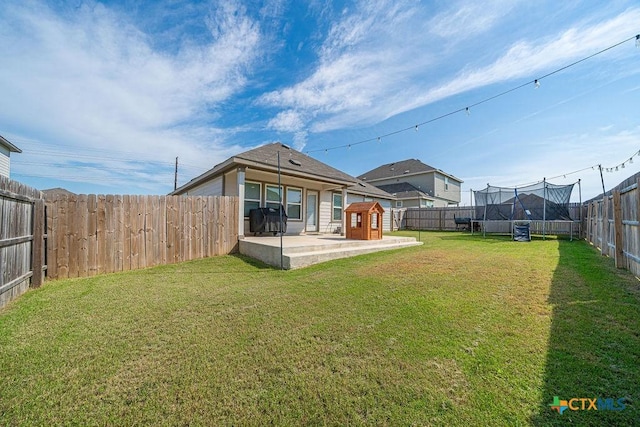 3627 Twin Dish Way, New Braunfels, TX 78130 - fenced backyard featuring a storage shed, a trampoline, and a patio