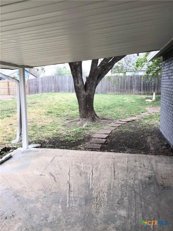 2004 Sherman Dr, Killeen, TX 76543 - fenced backyard with a patio