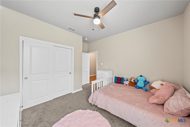 bedroom featuring carpet floors, a closet, ceiling fan, and baseboards