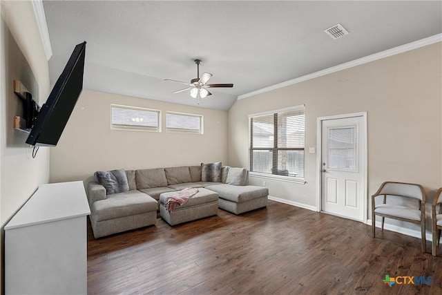 living area with a ceiling fan, wood finished floors, ornamental molding, baseboards, and vaulted ceiling