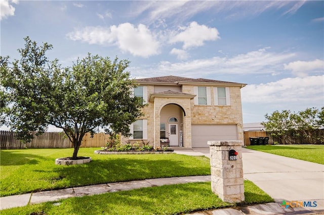 201 Boulder Ridge Dr, Cuero, TX 77954 - view of front of property featuring an attached garage, driveway, and stone siding