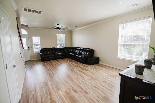 201 Boulder Ridge Dr, Cuero, TX 77954 - living room with baseboards, light wood-style flooring, crown molding, and ceiling fan