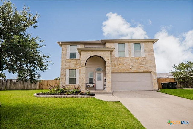 201 Boulder Ridge Dr, Cuero, TX 77954 - view of front of house featuring stone siding, concrete driveway, and an attached garage