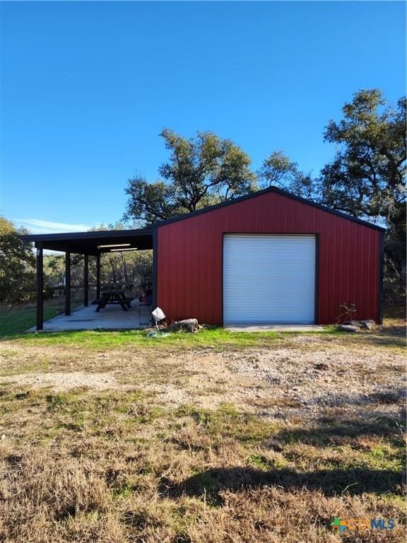 view of outdoor structure with a garage