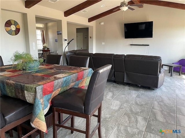 dining space featuring vaulted ceiling with beams and ceiling fan