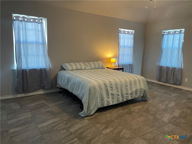 bedroom with lofted ceiling