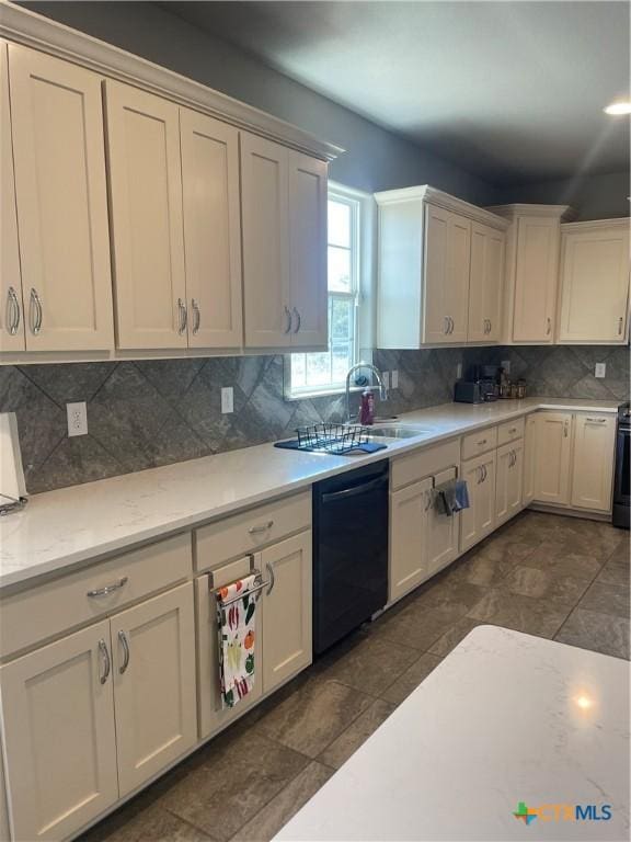 kitchen featuring tasteful backsplash, dishwasher, sink, and white cabinets