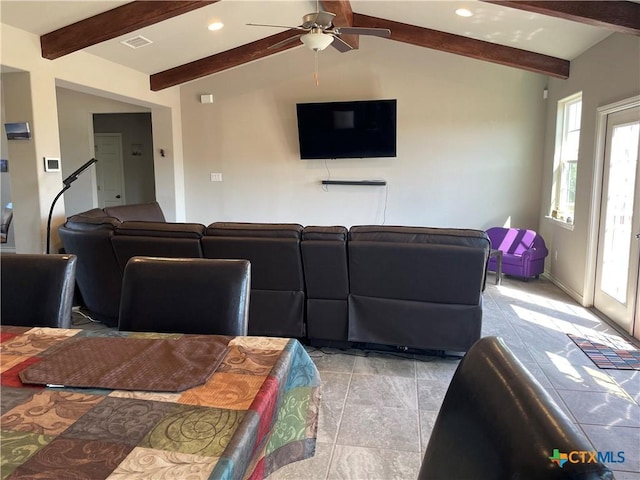 living room featuring vaulted ceiling with beams and ceiling fan