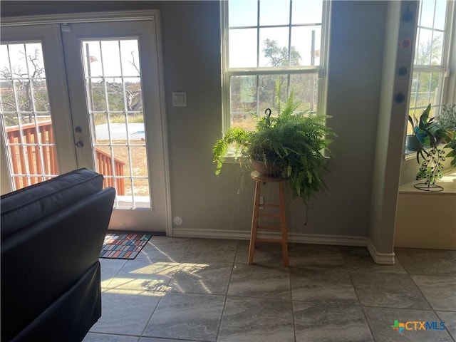 entryway with a healthy amount of sunlight and french doors