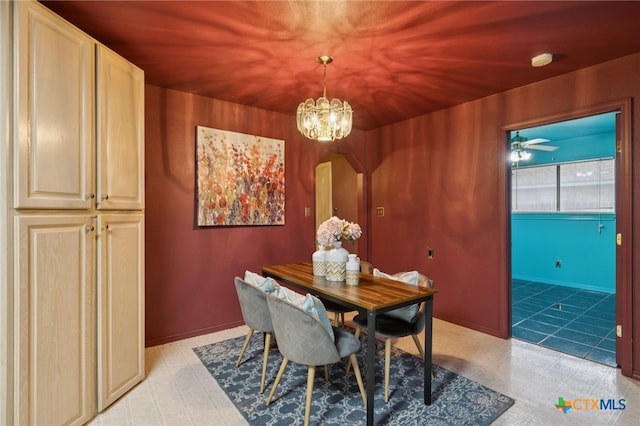 1062 Rolling Path, New Braunfels, TX 78130 - dining room featuring a chandelier, arched walkways, and light floors