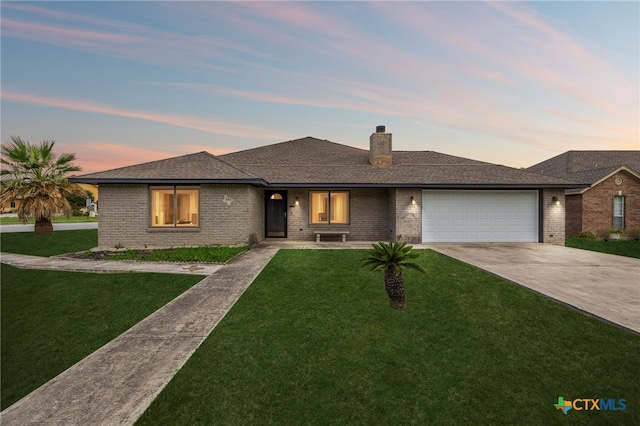 1062 Rolling Path, New Braunfels, TX 78130 - view of front of house featuring concrete driveway, an attached garage, a front lawn, and brick siding