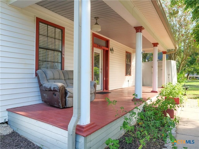 wooden terrace with a porch