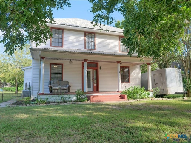 view of front of house with a porch and a front yard