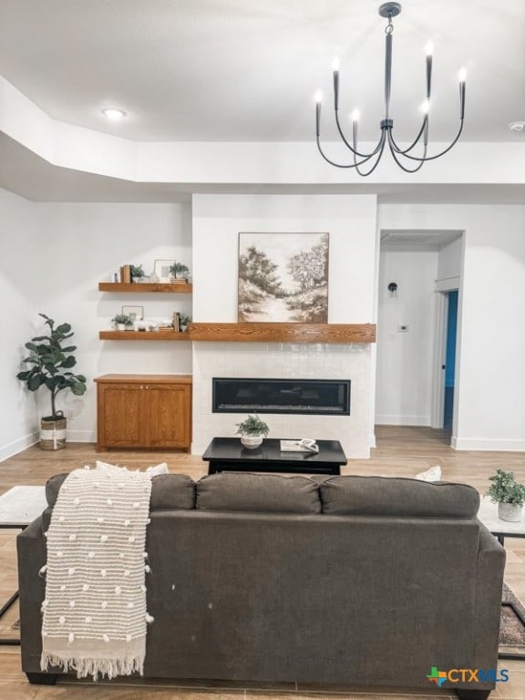 living room with a chandelier and wood-type flooring