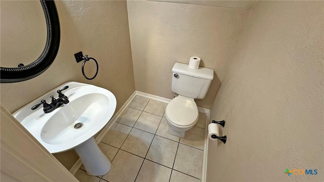 601 Barber Dr, Copperas Cove, TX 76522 - bathroom with tile patterned flooring, toilet, baseboards, and a sink