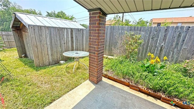 601 Barber Dr, Copperas Cove, TX 76522 - view of yard with a shed, fence, an outdoor structure, and a patio