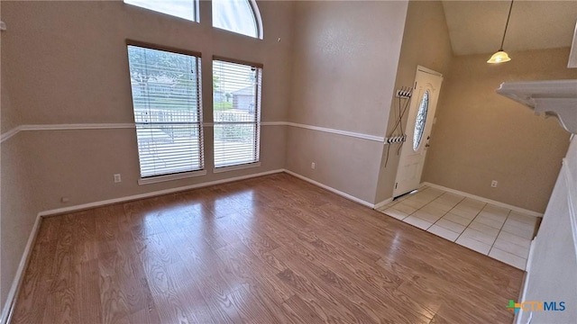 601 Barber Dr, Copperas Cove, TX 76522 - entryway featuring baseboards, wood finished floors, and high vaulted ceiling
