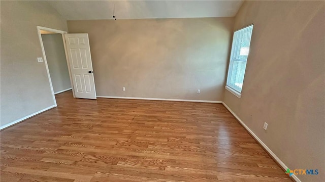 601 Barber Dr, Copperas Cove, TX 76522 - unfurnished room featuring wood finished floors, baseboards, and vaulted ceiling
